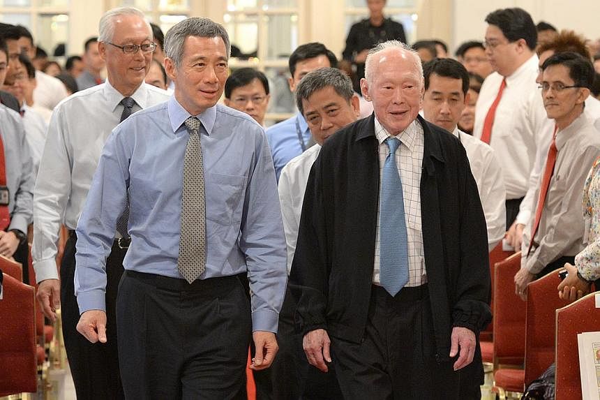 Prime Minister Lee Hsien Loong (left), former prime minister Lee Kuan Yew and Emeritus Senior Minister Goh Chok Tong (behind PM Lee) at the Istana for the Corrupt Practices Investigation Bureau’s 60th-anniversary commemorative ceremony on Sept 18, 
