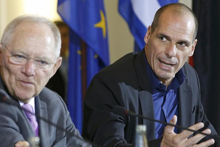 German Finance Minister Wolfgang Schaeuble (left) and Greek Finance Minister Yanis Varoufakis address a news conference following talks at the finance ministry in Berlin on Feb 5, 2015.&nbsp;The German Finance Minister said on Sunday, March 1, that G