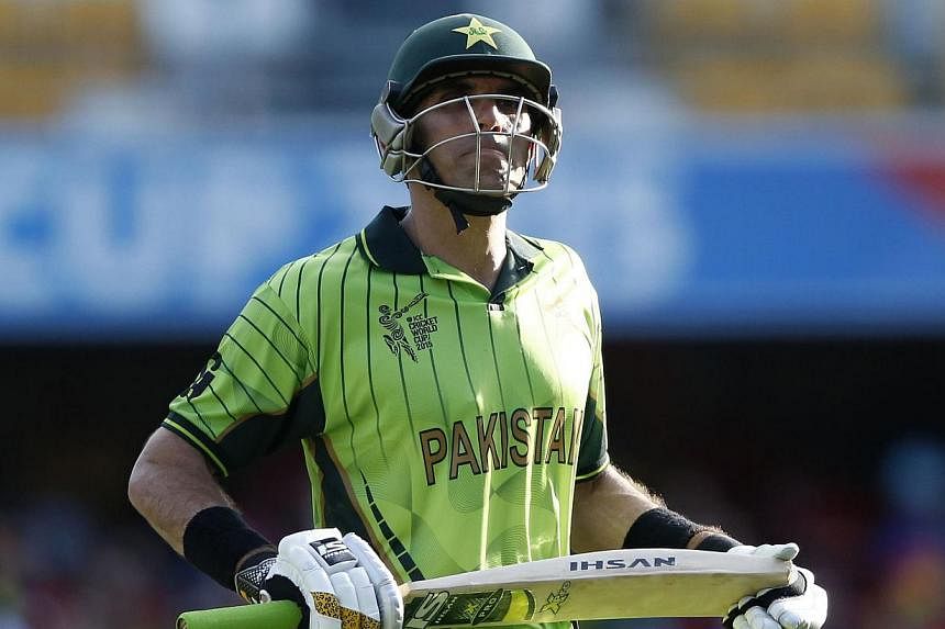 Pakistan's captain Misbah-ul-Haq reacts as he walks off the ground after being dismissed for 73 runs during their Cricket World Cup match against Zimbabwe at the Gabba in Brisbane March 1, 2015. -- PHOTO: REUTERS