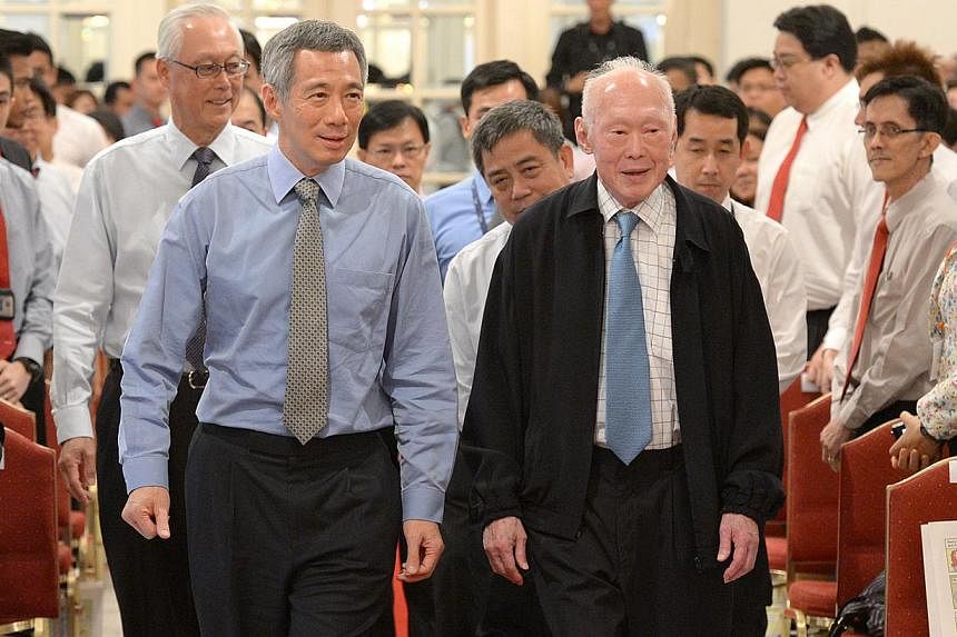 Prime Minister Lee Hsien Loong (left), former prime minister Lee Kuan Yew and Emeritus Senior Minister Goh Chok Tong (behind PM Lee) at the Istana in 2012. A key tenet of governance here has always been to ensure that good people will be in charge, M