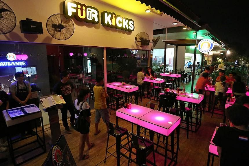 Punggol newcomers also include bistro bar Fur Kicks (left) in The Punggol Settlement. Brunch cafe Whisk & Paddle in Tebing Lane is co-owned by (above from left) Pan siblings Victoria, 29, Junjie, 26, and Shushan, 28. With them is chef Mario Ian Lee (