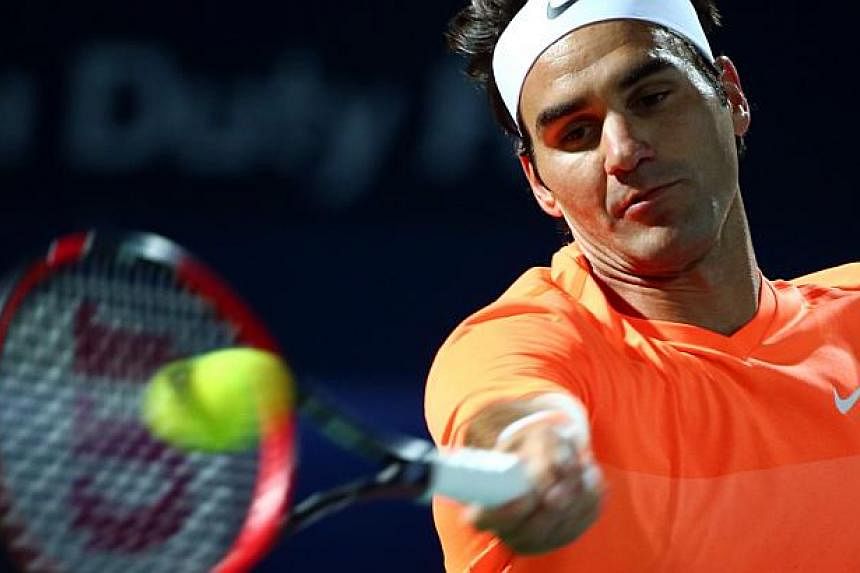 Roger Federer in action (above) at the Dubai Open on Feb 28, 2015. Federer scored the 84th title win of his career, kept his nose in front in his personal rivalry with Novak Djokovic, and equalled his best achievement at any tournament by winning the