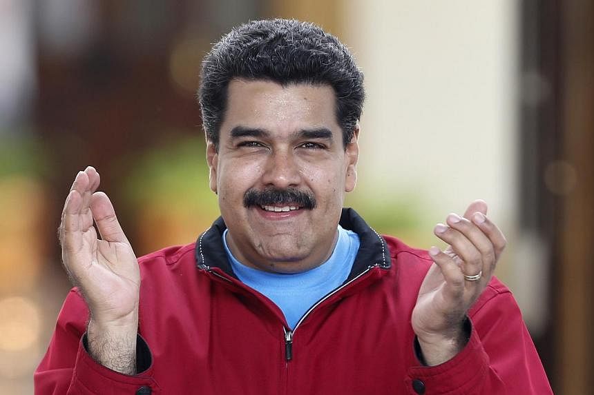 Venezuelan President Nicolas Maduro (above) announced Saturday he was implementing a mandatory visa system for all American citizens visiting the country, as a way to "control" US interference. -- PHOTO: REUTERS