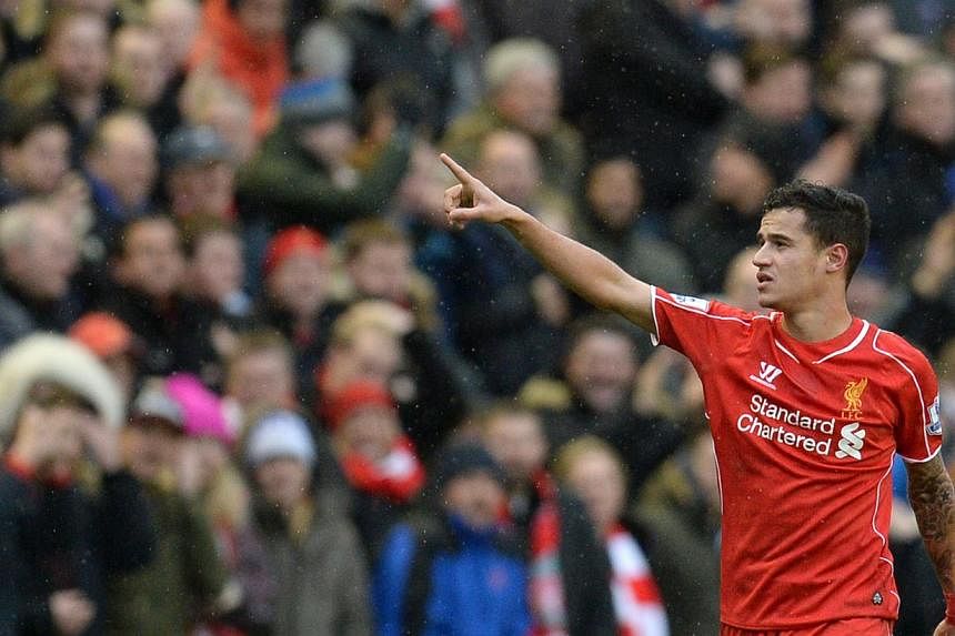 Liverpool's Brazilian midfielder Philippe Coutinho celebrates scoring their second goal during the English Premier League football match against Manchester City at Anfield in Liverpool, north west England, on March 1, 2015.&nbsp;-- PHOTO: AFP&nbsp;