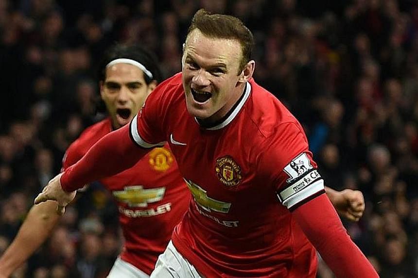 Manchester United's English striker Wayne Rooney celebrates scoring a penalty against Sunderland at Old Trafford on Feb 28, 2015. -- PHOTO: AFP