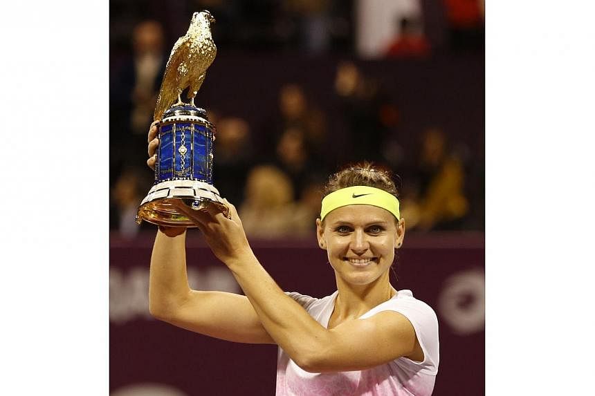 Lucie Safarova of the Czech Republic celebrates her Qatar Open win on Feb 28, 2015 in Doha. -- PHOTO: AFP