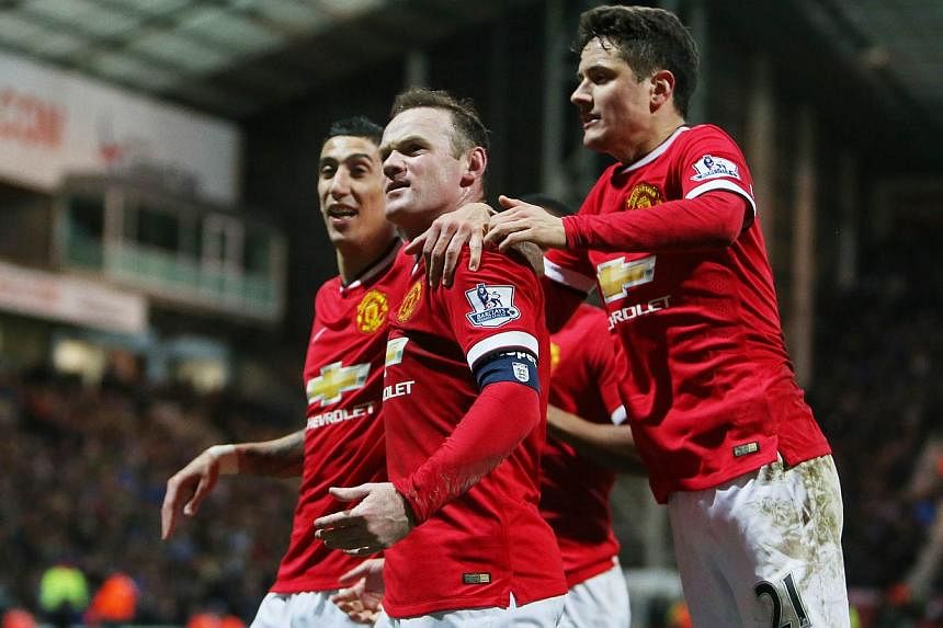 Manchester United's Wayne Rooney (centre) celebrates scoring their third goal with Angel Di Maria (left) and Ander Herrera during their FA Cup match against Preston North End on Feb 16, 2015.&nbsp;Di Maria is a great player and will rediscover his be