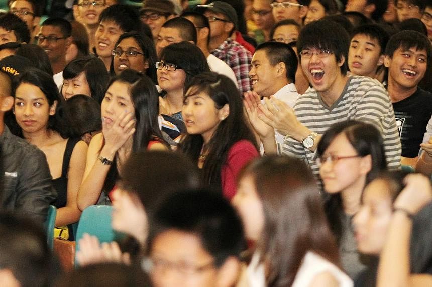 Junior College students cheering during the release of GCE A-level results. About 14,000 students took the A-level examinations last year and will be collecting their results on March 2, 2015. -- PHOTO: ST FILE&nbsp;