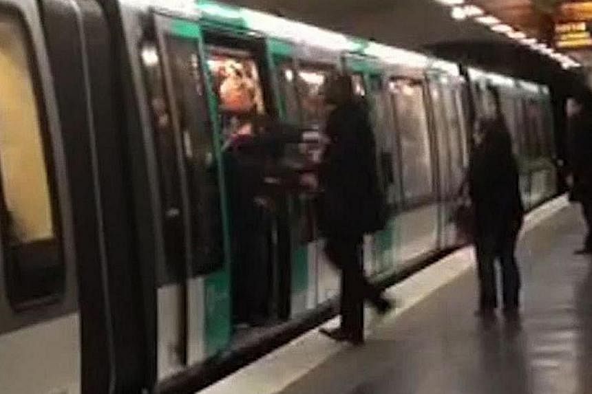 A video grab taken from footage obtained from Guardian News &amp; Media Ltd in the United Kingdom on Feb 18, 2015 shows Chelsea football fans packed onto a Paris Metro train pushing a passenger to prevent him from boarding the carriage at a station i