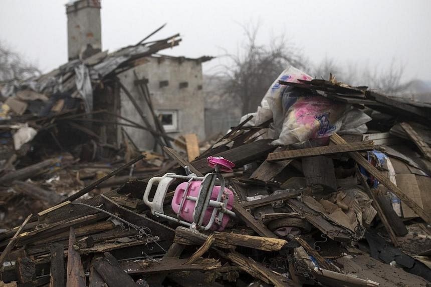 A child's toy is seen in the ruins of a house in a neighborhood near the Donetsk airport on March 1, 2015. United Nations' High Commissioner for Human Rights Zeid Ra'ad Al Hussein on March 2&nbsp;said more than 6,000 have been killed in the violence 
