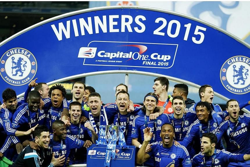 Chelsea players celebrate after winning the Capital One Cup.&nbsp;Chelsea manager Jose Mourinho said he felt "like a kid" after claiming the first trophy of his second Stamford Bridge tenure with a League Cup final victory over Tottenham Hotspur. -- 