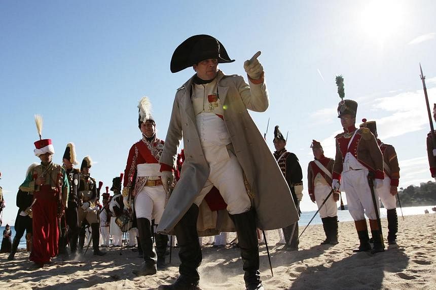 French actor Frank Samson, dressed as French Emperor Napoleon Ier performs, during the reenactment of Napoleon's landing, on Sunday, in Vallauris Golfe-Juan, southeastern France. This commemoration celebrates the bicentenary of the Emperor's landing 