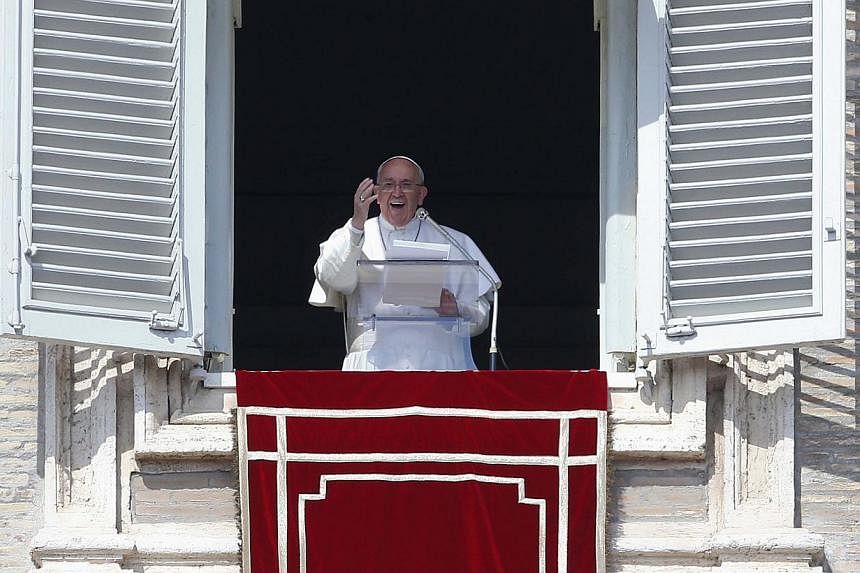 &nbsp;Pope Francis leads his Sunday Angelus prayer in Saint Peter's square at the Vatican on Sunday. -- PHOTO: REUTERS
