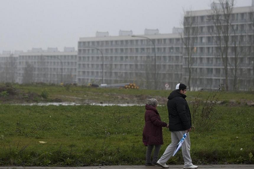 Picture taken on November 14, 2014 in Aarhus shows people walking in one of Denmark's poorest neighbourhoods. Danish authorities forced a 15-year-old boy into a juvenile home in an unusual move to thwart Islamist radicalisation, local media reported 