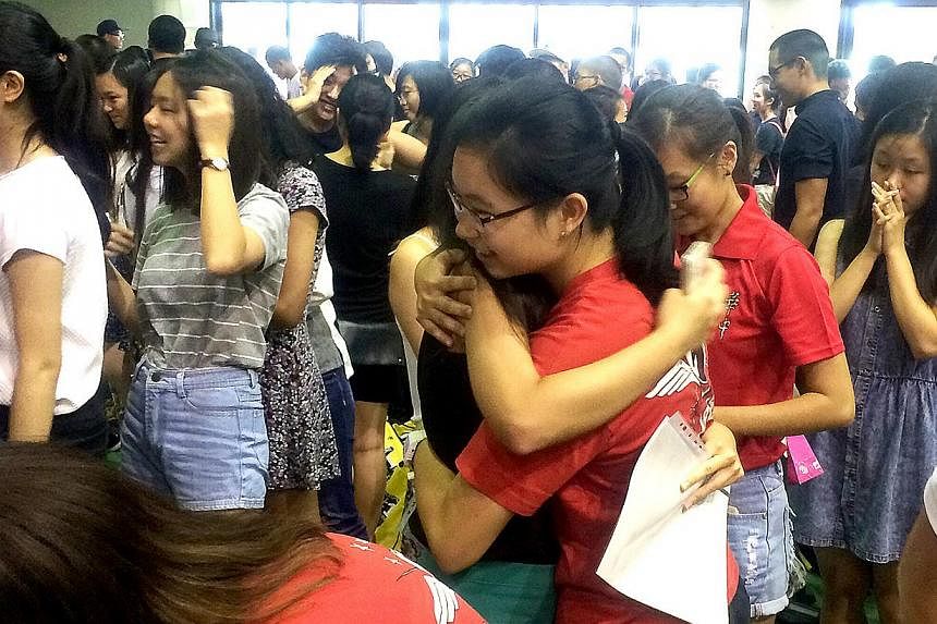 Hwa Chong Institution students received their A level results in their school hall on March 2, 2015. About 91.4 per cent of the 14,185 students who took last year's GCE A-level examination scored at least three H2 passes, with a pass in General Paper