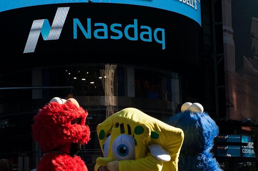 The Nasdaq Composite added 0.9 per cent to 5,008.10 at 4 pm in New York, reaching a 15-year high. -- PHOTO: AFP&nbsp;