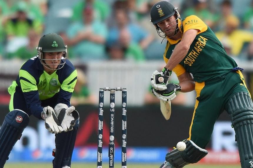 South Africa's batsman AB De Villiers (right) plays a shot during the Ireland and South Africa in the ICC Cricket World Cup match at the Manuka Oval in Canberra, Australia, March 3, 2015. -- PHOTO: EPA