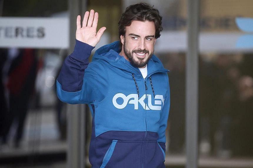 McLaren's Formula One driver Fernando Alonso of Spain gestures to the media in Sant Cugat, north of Barcelona on&nbsp;Feb 25, 2015. Alonso will miss the opening race of the 2015 season in Australia after suffering concussion in a crash in testing, hi