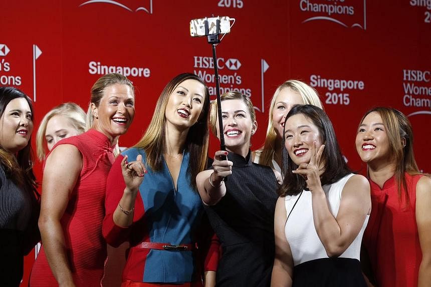 (Left to right) Inbee Park, Jessica Korda (partially blocked), Suzanne Pettersen, Michelle Wie, Paula Creamer, Anna Nordqvist (partially blocked), Chella Choi and Lydia Ko take a group selfie after a catwalk segment of the HSBC Women's Champions pres