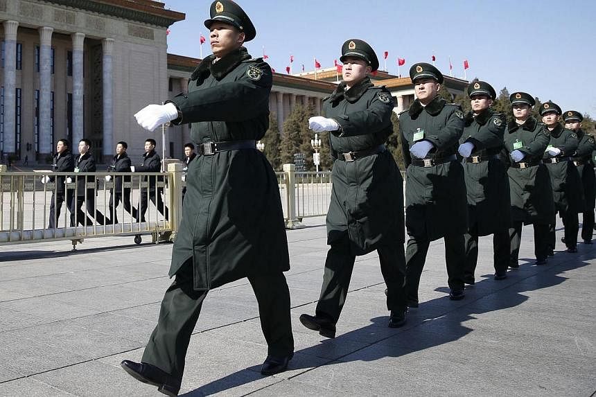Soldiers from China's People's Liberation Army (PLA) march ahead of the opening session of Chinese People's Political Consultative Conference (CPPCC) at Tiananmen Sqaure in Beijing on March 3, 2015.&nbsp;China will hold a military parade to mark the 
