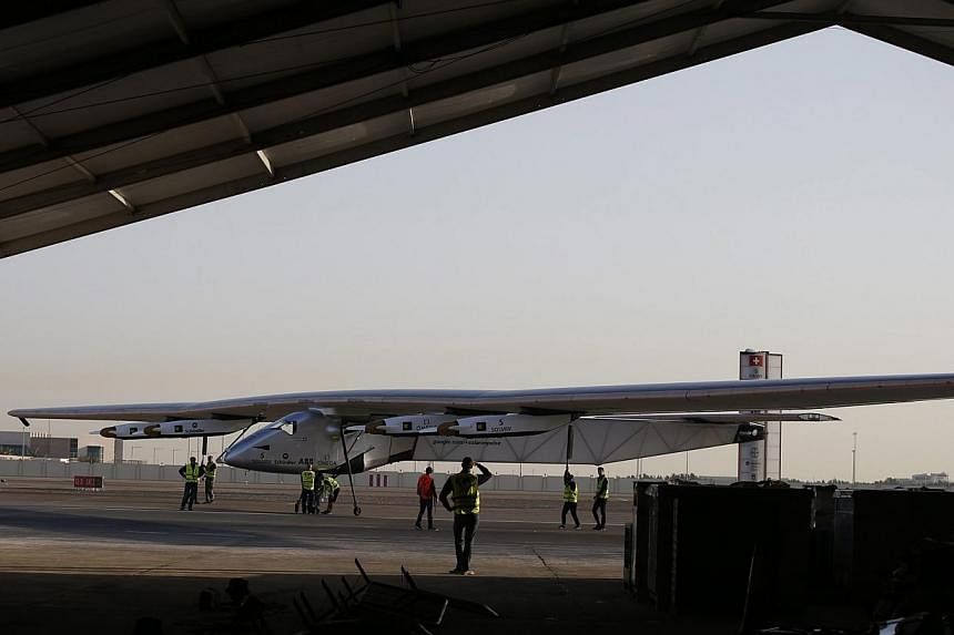The Solar Impulse 2 landing after the third test flight in Abu Dhabi on March 2, 2015. -- PHOTO: EPA