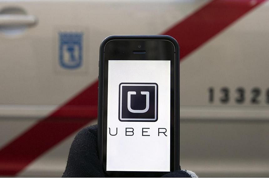 Uber said that the car involved in an alleged case of overcharging, with a licence plate SJT 1444Y, was not registered with the company, and it has filed a police report over the incident. -- PHOTO: REUTERS