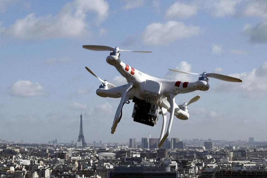 Illustration of a drone flying over Paris on Feb 27, 2015.&nbsp;A French court on Tuesday fined a British journalist €1,000 (S$1,500) for flying a drone over central Paris and confiscated the machine, as authorities scramble to explain a recent ser