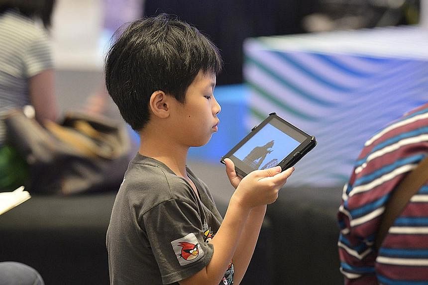 A child using an iPad. -- PHOTO: ST FILE