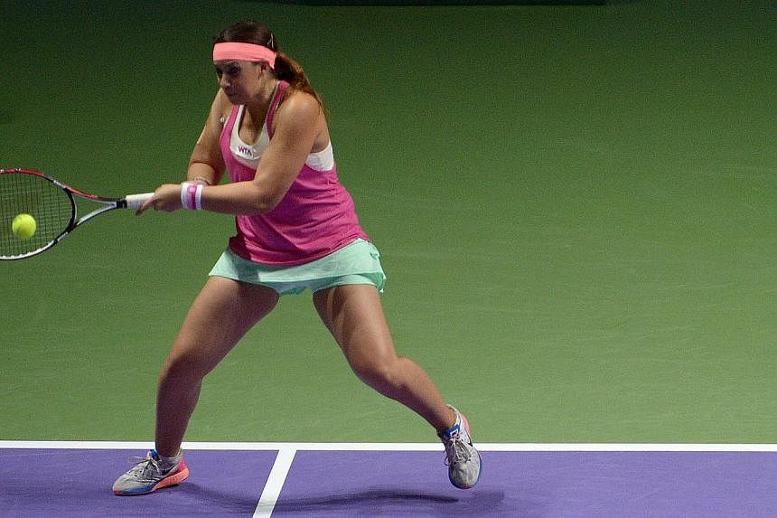 Retired star Marion Bartoli playing in the Legends match at the Singapore Indoor Stadium on Oct 20, 2014.&nbsp;The former Wimbledon champion sparked speculation about a return from retirement on Tuesday - less than two years after bowing out of profe