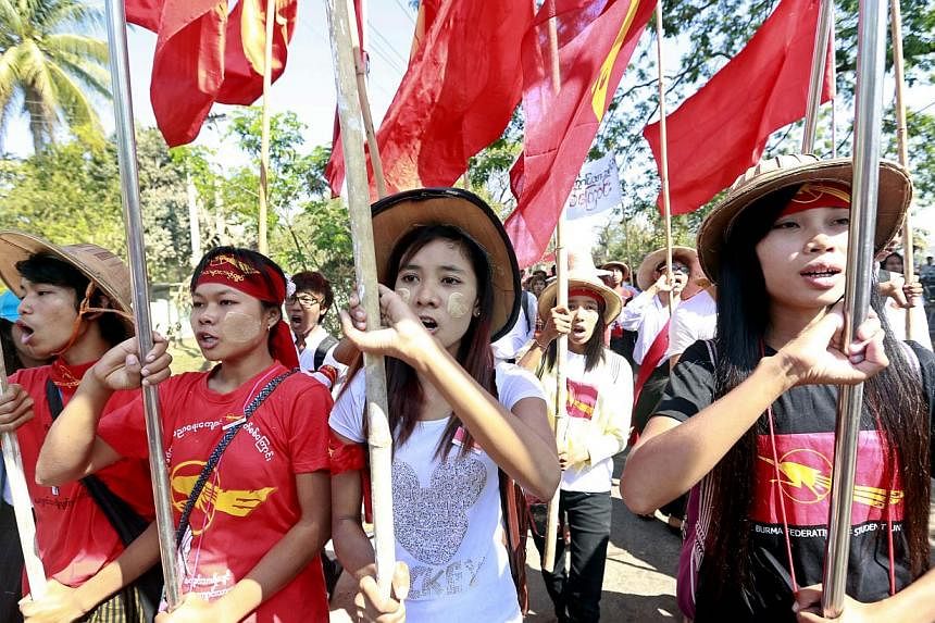 Student shout slogans as they march on the road at Letpadan, Bago division, Myanmar, on March 3, 2015.&nbsp;Student protesters calling for education reform on Tuesday defied an order to disperse in a tense standoff with hundreds of riot police in cen