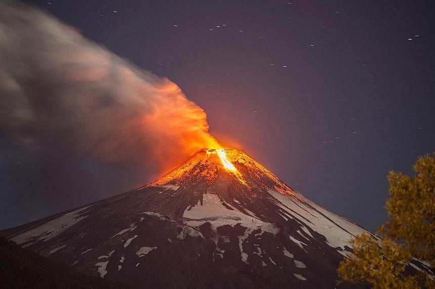 Villarrica volcano, which is located in southern Chile and is one of the South American nation's most active,&nbsp;began erupting on March 3, 2015, forcing the evacuation of some 3,600 people in nearby villages, the government said. -- PHOTO: AFP&nbs