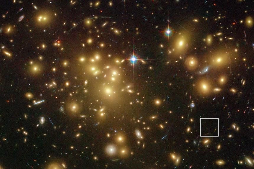 A photo released by the European Southern Observatory (ESO) last week shows the NASA/ESA Hubble Space Telescope image of the rich galaxy cluster Abell 1689. The huge concentration of mass bends light coming from more distant objects and can increase 
