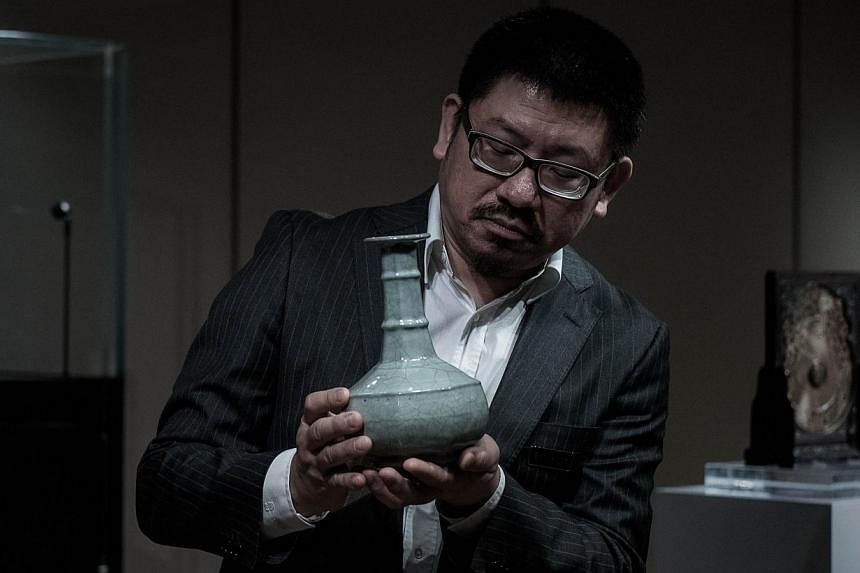 A Chinese Guan Vase of the Southern Song Dynasty is shown to the media in Hong Kong on Monday. The rare vase is expected to fetch more than 60 million HKD &nbsp;at Sotheby’s Hong Kong Chinese Works of Art Spring Sales 2015 which will take place on 