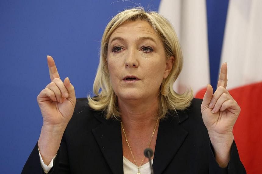 France's National Front political party head Marine Le Pen gestures as she speaks during a news conference at the party headquarters in Nanterre near Paris on Feb 6, 2015.&nbsp;The far-right leader on Tuesday, March 3, 2015, accepted an offer to sit 