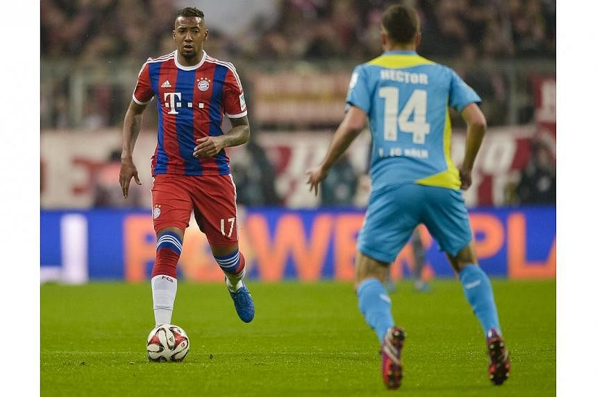 Bayern Munich's defender Jerome Boateng (left) and Cologne's defender Jonas Hector vie for the ball during their German first division Bundesliga football match in Munich on Feb 27, 2015.&nbsp;Boateng revealed he turned down an offer to join Barcelon