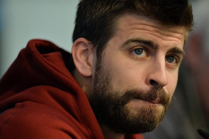 A Spanish judge hit Barcelona star Gerard Pique (above) with a heavy fine after the 2010 World Cup winner lost his temper and insulted two traffic policemen. -- PHOTO: EPA