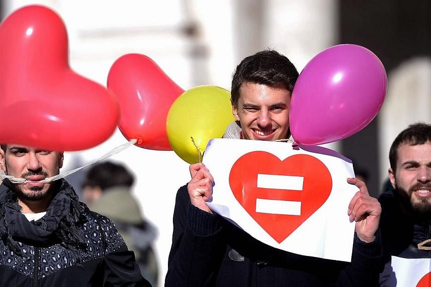 Gay rights supporters stage a protest at Rome's capitol hill square on Jan 28, 2015. Slovenia joined a growing number of European countries that allow same-sex marriages late on Tuesday, almost three years after a similar law was rejected in a nation