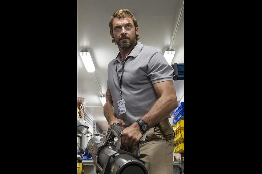 Hugh Jackman stars in Chappie as a former military man who tries to decimate the titular sentient robot.