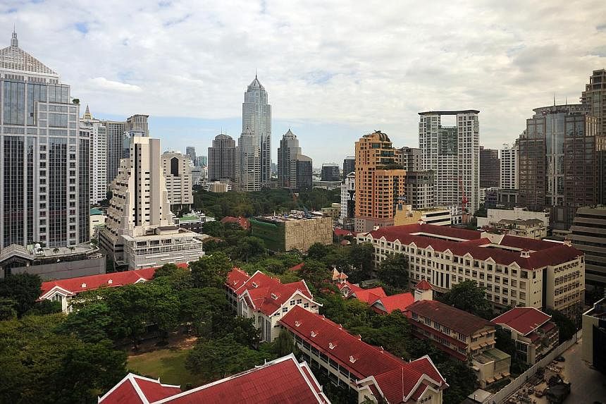 Skyline of Bangkok, Thailand. The Land of Smiles has lived up to its moniker and received the lowest score on the misery index, and therefore the top spot on Bloomberg's happiest list. -- PHOTO: ST FILE&nbsp;