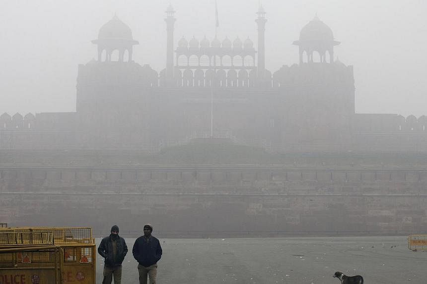The Red Fort covered by haze mainly caused by air pollution in Delhi, India, on Jan 20, 2014. -- PHOTO: BLOOMBERG