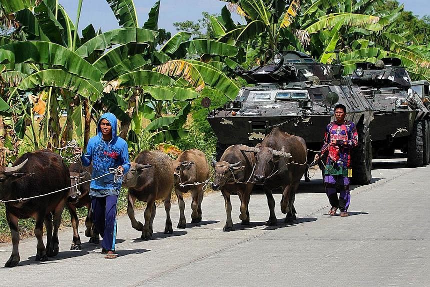 About 45,000 people have fled their homes in the impoverished southern Philippines as the military hunts Islamic militants, including a top terror suspect wanted by the United States, authorities said on Wednesday. -- PHOTO: AFP
