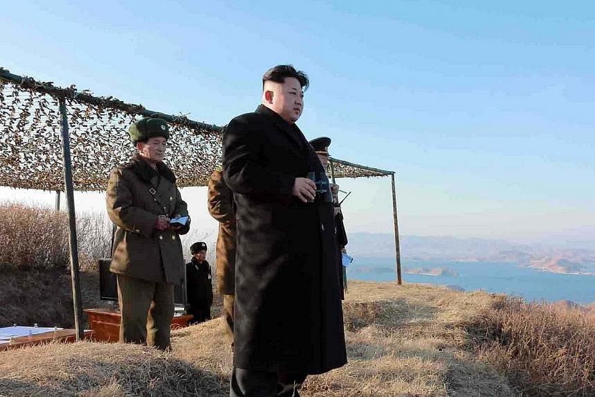 This undated picture released from North Korea's official Korean Central News Agency (KCNA) on Feb 8, 2015 shows North Korean leader Kim Jong-Un (centre) inspecting the test-firing of a new type of "anti-ship rocket" to be equipped at Korean People's