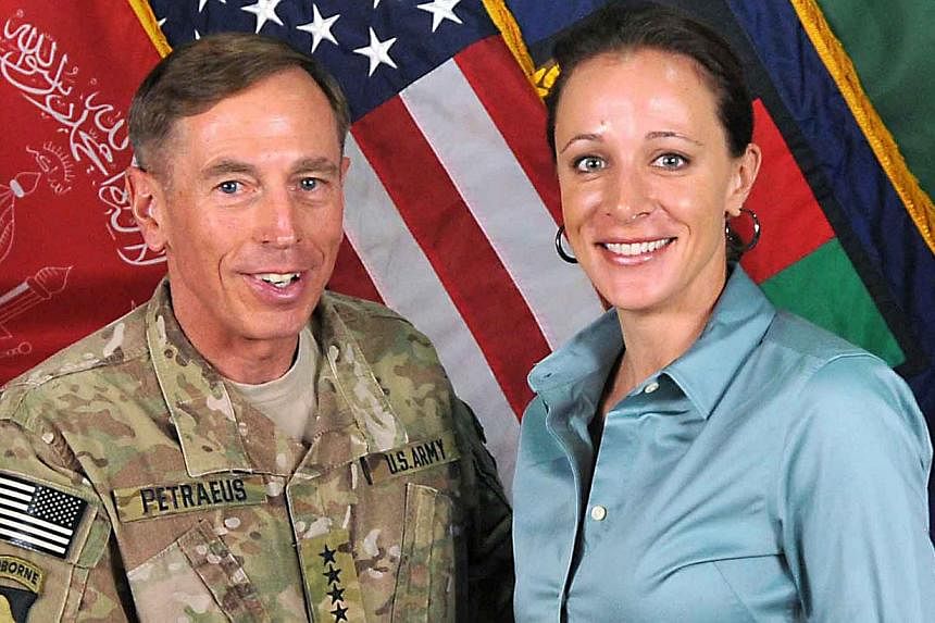 US Gen David Petraeus poses with his biographer Paula Broadwell in Afghanistan in 2011. -- PHOTO: AFP&nbsp;