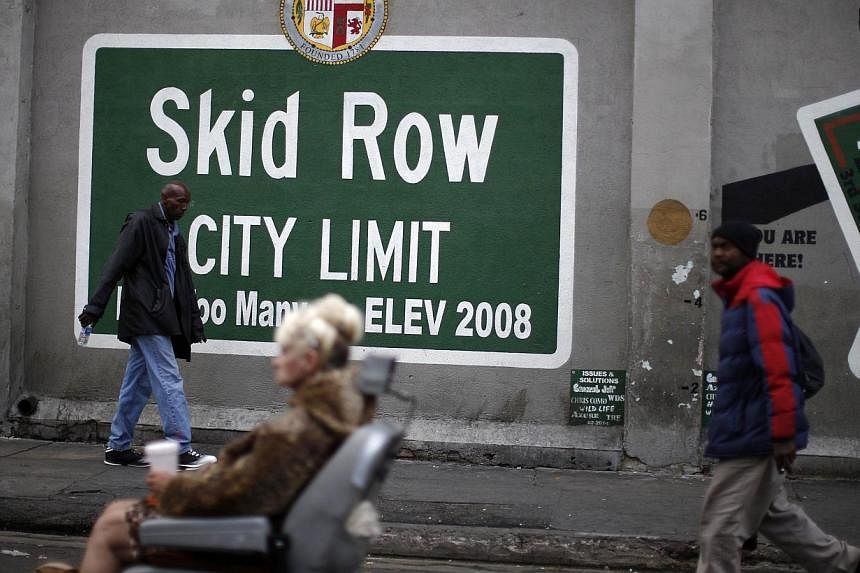 People view a memorial for a man killed by police on skid row in Los Angeles, California on Monday. -- PHOTO: REUTERS