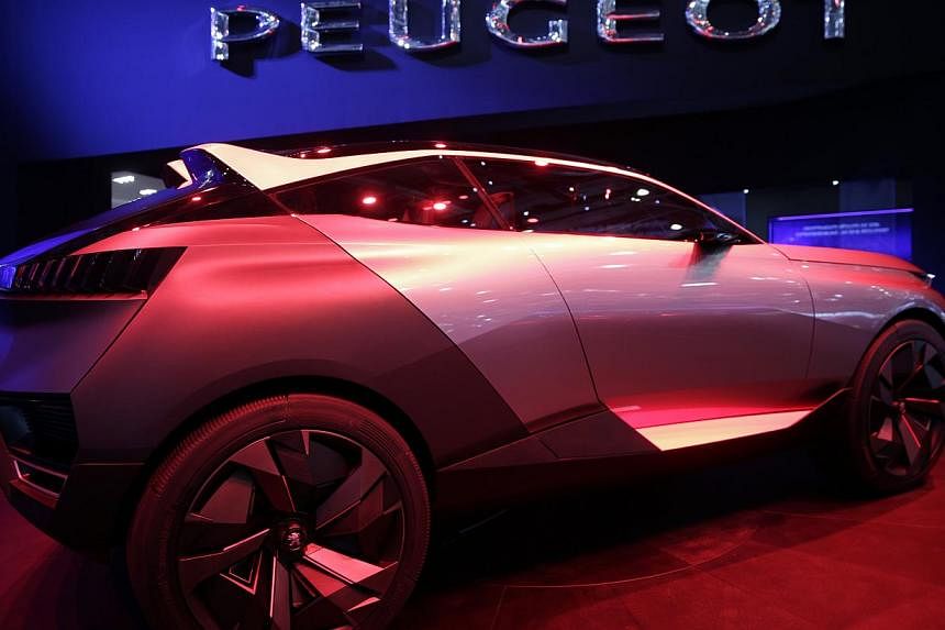 A Peugeot Quartz concept automobile, produced by PSA Peugeot Citroen, stands on display ahead of the 85th Geneva International Motor Show in Switzerland. The show opens to the public on Thursday. -- PHOTO: BLOOMBERG