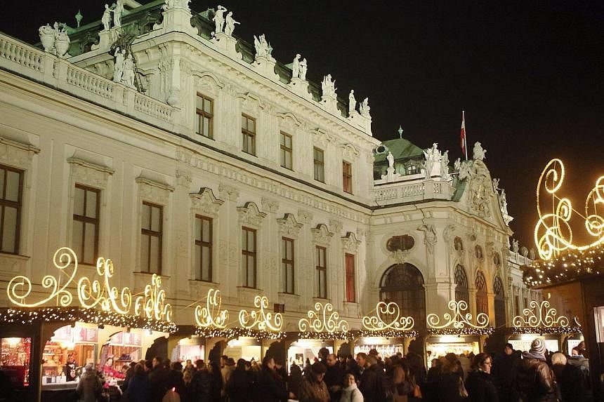 The Belvedere palace is pictured behind an advent market in Vienna on Dec 15, 2014.&nbsp;Vienna, Austria's elegant capital on the Danube river, has again been commended as offering the best quality of life of any city in the world. -- PHOTO: REUTERS