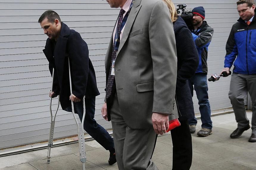Boston Marathon bombing survivor Marc Fucarile (left) leaves the federal courthouse on the first day of the trial of accused bomber Dzhokhar Tsarnaev in Boston, Massachusetts on Mar, 4, 2015. Survivors of the 2013 bombings choked back tears on Wednes