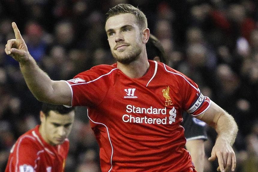 Jordan Henderson celebrates after scoring the first goal for Liverpool during their English Premier League match against Burnley at Anfield&nbsp;on March 4, 2015.&nbsp;Reds manager Brendan Rodgers said Henderson could aspire to reach an even higher l