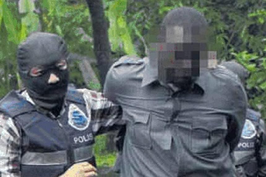 A Somalian man believed to be a member of a terrorist group known as Al-Shabaab being detained by officers from the Bukit Aman Special Branch Counter Terrorism Unit. Malaysia's new anti-terrorism law will give authorities power to detain terror suspe