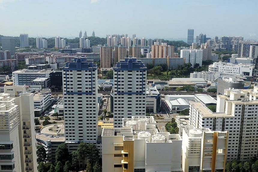 Resale prices for Housing Board flats were back to their downward trend in February as predicted by property analysts, slipping 0.6 per cent compared with January, and bringing prices 5.7 per cent lower than a year ago. -- PHOTO: ST